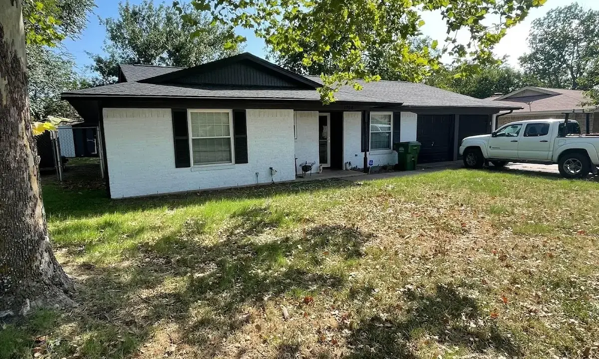 Professional roofing crew working on a residential roof in Villas
